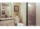 Clean bathroom with a single sink vanity, toilet, and shower at 6922 Copper Sky Cir, Castle Pines, CO 80108