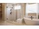 Spa-like bathroom with a large shower and soaking tub at 6922 Copper Sky Cir, Castle Pines, CO 80108