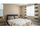 Bedroom with double bed, window, and dinosaur bedding at 6922 Copper Sky Cir, Castle Pines, CO 80108