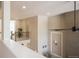 Open interior with a view of the staircase and upper hallway showcasing modern design elements and natural light at 6922 Copper Sky Cir, Castle Pines, CO 80108
