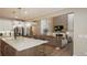 Modern kitchen with island, white cabinets, and stainless steel appliances at 6922 Copper Sky Cir, Castle Pines, CO 80108