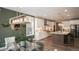 Open concept kitchen with island and stainless steel appliances at 6922 Copper Sky Cir, Castle Pines, CO 80108