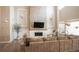 Living room with large sectional sofa and a modern fireplace at 6922 Copper Sky Cir, Castle Pines, CO 80108