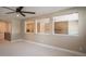 Spacious loft area with ceiling fan and multiple windows at 6922 Copper Sky Cir, Castle Pines, CO 80108