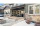 Covered patio with stone flooring and outdoor seating at 6922 Copper Sky Cir, Castle Pines, CO 80108