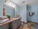 Bright bathroom with a tiled floor, vanity, sink, and shower at 11093 Milliken Ave, Conifer, CO 80433