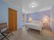 A cozy bedroom with mountain-themed wall decor, soft lighting, and a minimalist aesthetic at 11093 Milliken Ave, Conifer, CO 80433