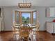 Cozy dining area featuring a wooden table and chairs set near a bay window at 11093 Milliken Ave, Conifer, CO 80433