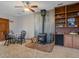 Cozy living room features a wood-burning stove, built-in bookcase, and a table with chairs at 11093 Milliken Ave, Conifer, CO 80433