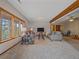 Inviting living room with cozy sofas, natural light, and scenic outdoor views, seamlessly connected at 11093 Milliken Ave, Conifer, CO 80433