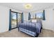 Cozy bedroom with large windows, balcony access and plush carpeting, perfect for relaxation at 7596 Rafter Rd, Franktown, CO 80116