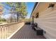 Spacious wooden deck with wicker seating at 7596 Rafter Rd, Franktown, CO 80116