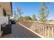 Spacious wooden deck with seating at 7596 Rafter Rd, Franktown, CO 80116