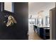 A stylish kitchen view through the door, featuring a large island with modern lighting at 7596 Rafter Rd, Franktown, CO 80116