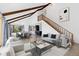 Bright and airy living room featuring vaulted ceilings, wooden beams, and an open floor plan at 7596 Rafter Rd, Franktown, CO 80116