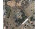 This aerial view showcases the house sitting on Colorow Dr with views of large rocks at 6227 Colorow Dr, Morrison, CO 80465