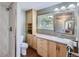 Bathroom featuring a spacious shower, modern fixtures, and ample storage at 6227 Colorow Dr, Morrison, CO 80465