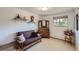 Bedroom featuring a futon, wood dresser, and natural light at 6227 Colorow Dr, Morrison, CO 80465