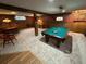 Spacious basement game room featuring a pool table and other game areas at 6227 Colorow Dr, Morrison, CO 80465