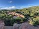 Picturesque landscape with mature trees and rock formations at 6227 Colorow Dr, Morrison, CO 80465