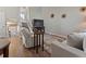 Inviting living area with a comfortable recliner, a large TV, and stylish decor, perfect for relaxing at 17411 E Layton Dr, Aurora, CO 80015