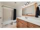 Updated bathroom with single sink vanity and shower/tub at 9110 E Lehigh Ave, Denver, CO 80237