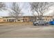 Street view of townhouses with a parked truck, showcasing neighborhood at 9110 E Lehigh Ave, Denver, CO 80237