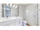 Modern bathroom with double vanity, white tiled shower, and contemporary fixtures at 1937 S Columbine St, Denver, CO 80210