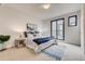 Bright bedroom with a cozy bed and a private balcony entrance at 1937 S Columbine St, Denver, CO 80210