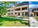 Modern townhome with balconies, well-kept lawn, and stylish architectural details at 1937 S Columbine St, Denver, CO 80210