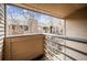Balcony area featuring an iron and wood railing, and a view of surrounding neighborhood at 6700 W 11Th Ave # 202, Lakewood, CO 80214