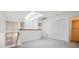 Bright bedroom featuring a skylight, neutral carpet, and closet at 6700 W 11Th Ave # 202, Lakewood, CO 80214