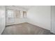 Cozy bedroom with neutral carpet, large window, and natural light at 6700 W 11Th Ave # 202, Lakewood, CO 80214