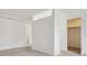 Bright bedroom featuring neutral carpet, white walls, with natural light and a closet at 6700 W 11Th Ave # 202, Lakewood, CO 80214