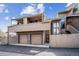 Exterior of a two-story home with two car garage, private balconies, and a fenced in yard at 6700 W 11Th Ave # 202, Lakewood, CO 80214