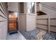Home exterior showcasing the front entrance with a glass door, rock detail and the architecture of the home at 6700 W 11Th Ave # 202, Lakewood, CO 80214