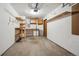 Empty two car garage with unfinished walls and ceiling, and a single service door at 6700 W 11Th Ave # 202, Lakewood, CO 80214