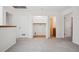 Hallway leading to the bathroom featuring a laundry area at 6700 W 11Th Ave # 202, Lakewood, CO 80214