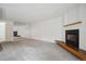 Bright open concept space featuring fireplace with mantel, carpet flooring, and a mirrored wall detail at 6700 W 11Th Ave # 202, Lakewood, CO 80214