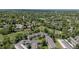 An aerial view showcasing the condo community surrounded by mature trees and landscaping at 4262 E Maplewood Way, Centennial, CO 80121