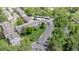 Aerial view showcasing the community's layout, featuring lush landscaping, community amenities, and convenient parking at 4262 E Maplewood Way, Centennial, CO 80121