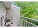 Balcony showcasing two chairs, and a lush green view, creating an inviting outdoor retreat at 4262 E Maplewood Way, Centennial, CO 80121