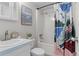 Bathroom featuring a vanity, toilet, tub and shower, complemented by artful decor at 4262 E Maplewood Way, Centennial, CO 80121