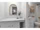 Bright bathroom showcasing a vanity, toilet and framed mirror for a sleek and functional space at 4262 E Maplewood Way, Centennial, CO 80121