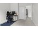 Bright bedroom with carpet flooring, featuring a desk and direct access to an adjacent room at 4262 E Maplewood Way, Centennial, CO 80121
