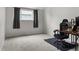 Bedroom featuring neutral walls, carpet flooring, and a desk creating a bright and functional space at 4262 E Maplewood Way, Centennial, CO 80121