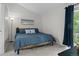 Bedroom featuring a high ceiling, window access to a balcony, carpet floor and a cozy atmosphere at 4262 E Maplewood Way, Centennial, CO 80121
