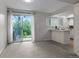 Bright dining area featuring sliding door to the exterior, seamlessly connects to the kitchen at 4262 E Maplewood Way, Centennial, CO 80121