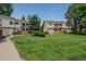 Charming townhomes with well-manicured lawns and mature trees, creating a serene and inviting community atmosphere at 4262 E Maplewood Way, Centennial, CO 80121