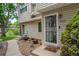 Charming townhome entrance featuring decorative door and manicured landscape at 4262 E Maplewood Way, Centennial, CO 80121